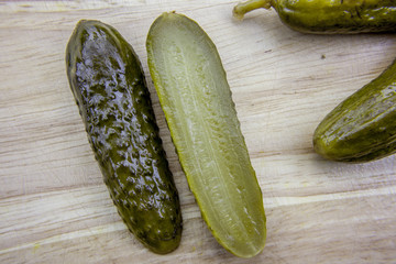 Sliced cucumber on wooden desk, close up picture. Healthy organic and vegetarian food, rustic style concept