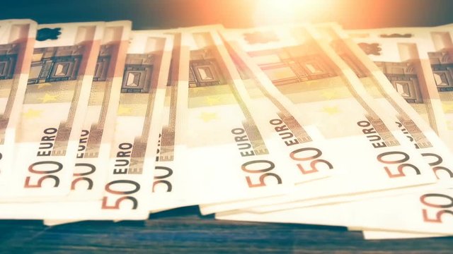 Pile of 50 euro banknotes, slider shot. Finances background