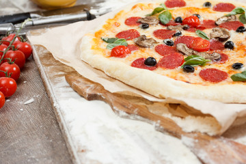 Assorted pizza with different fillings served on wooden table with ingredients