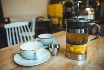 comfy cafe couple cups and french press with tea