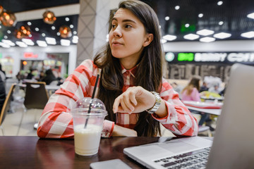 woman work in cafe on laptop