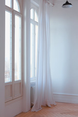 large Windows with curtains in white loft interior