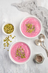 Smoothie bowl with chia and pumpkin seeds for healthy vegan vegetarian diet breakfast, top view, flat lay.