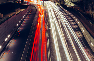 Fototapeta na wymiar City light trails of fast moving traffic on road in London at night