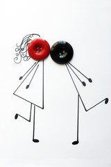 kissing couple. child's figure with head-buttons