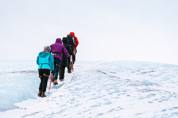 mountaineers hiking a glacier