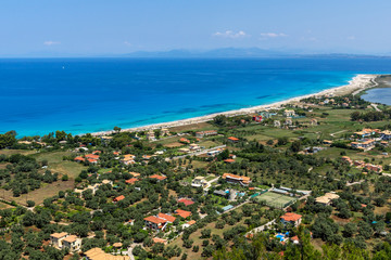Panoramic view of Agios Ioanis beach with blue waters, Lefkada, Ionian Islands, Greece
