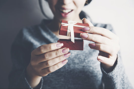 Woman Opening Gift Box