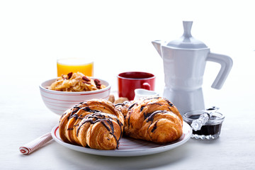 Croissant with Chocolate Espresso with milk and a glass of orange juice Tradition Dry Dry with goji berries Morning Baking sweet Dessert on the White Background
