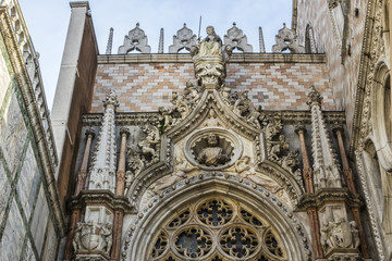 Architectural fragment of Doge Palace entrance (Palazzo Ducale, 1340) from St. Mark Square. Palace was the residence of the Doge of Venice. Veneto, Italy.