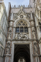 Architectural fragment of Doge Palace entrance (Palazzo Ducale, 1340) from St. Mark Square. Palace was the residence of the Doge of Venice. Veneto, Italy.