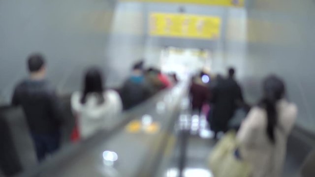 passenger on moving escalator blur motion