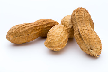 Dried peanuts on the white background.