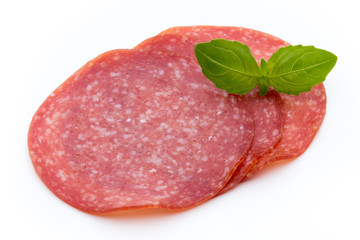 Salami slices isolated on white background.