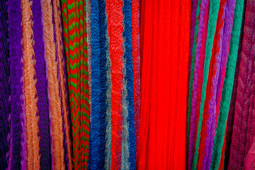 Colorful Mexican blankets for sale at market, Latin America, fabric background