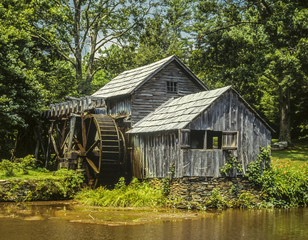 Old mill by stream