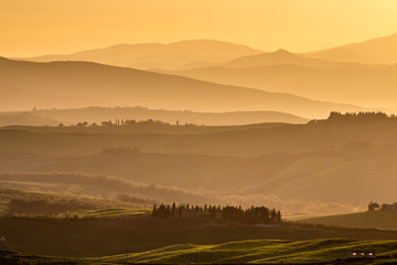 Naklejka na ściany i meble View of rolling countryside at sunset, Pienza, Tuscany, Italy