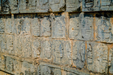 Close up of carved forms in the rock the enter of the Chichen Itza, one of the most visited archaeological sites in Mexico