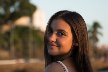 Portrait of girl smiling in the light of sunset