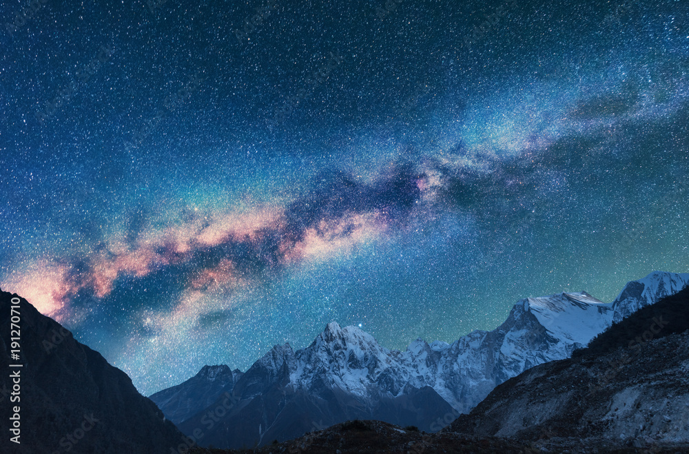 Wall mural space. milky way and mountains. fantastic view with mountains and starry sky at night in nepal. moun
