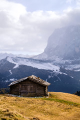 Fototapeta na wymiar Wooden cottage in dolomities alps Italy