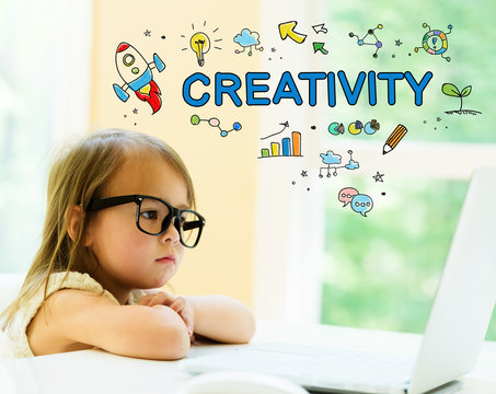 Creativity text with little girl using her laptop