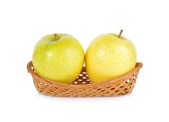 fresh Japanese Toki apples in bamboo basket on white background