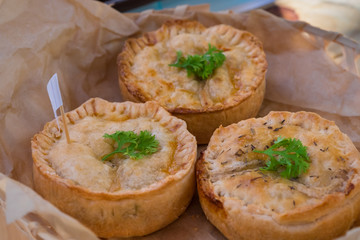 Round chicken meat pie in pastry shop