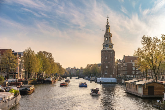 Amsterdam sunset city skyline at Montelbaanstoren Tower, Amsterdam, Netherlands