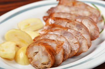 Chinese-style sausages with garlic on the plate