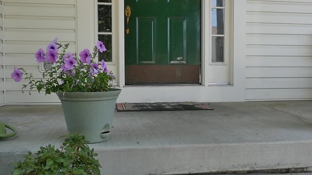 Throwing Luggage Suitcase out the Front Door on Porch in Slow Motion