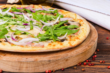 Vegetarian pizza with mushrooms shot close-up