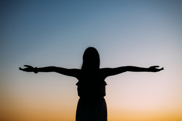 woman stand open hand with sky background