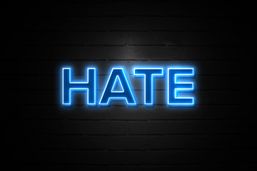 Fototapeta na wymiar Hate neon Sign on brickwall