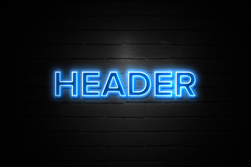 Header neon Sign on brickwall