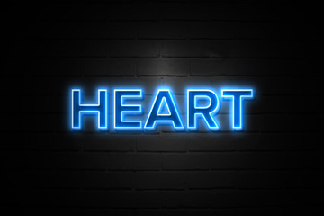 Fototapeta na wymiar Heart neon Sign on brickwall