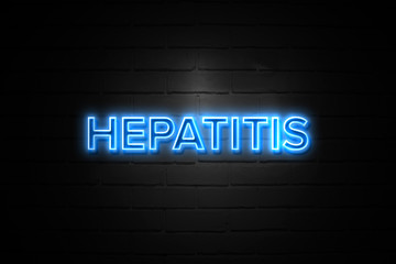 Obraz premium Hepatitis neon Sign on brickwall