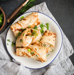 Pancakes with meat, herbs and sour cream - traditional for Russian pancake week Maslenitsa - spring festival. Happy Shrove Tuesday