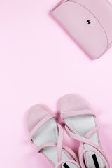 Women stylish, elegant fashion flat lay. Trendy sandals, purse in pink color.