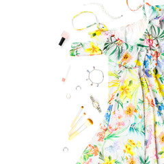 Woman summer dress, accessories and make up items on white background. Summer fashion collection
