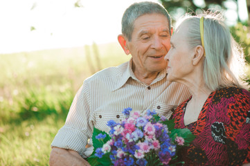 beautiful happy old people sitting in the  park