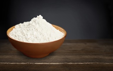 Wheat ears and flour on the desk