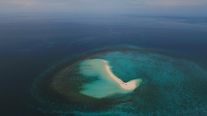 Aerial view of beautiful sand tropical island with white sand beach, Camiguin. White sand island. Beautiful beach, sea. Seascape: ocean and beautiful beach paradise. Philippines. Travel concept.