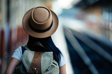 Women are standing on the map while traveling to Thailand.
