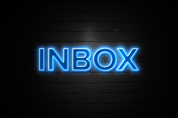 Inbox neon Sign on brickwall