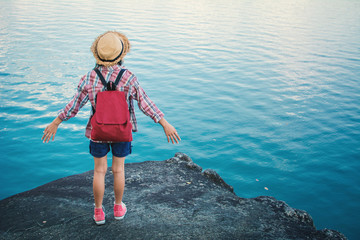 Asian girl backpack in nature , Relax time on holiday concept travel,selective and soft focus,tone of hipster style