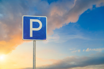 parking sign close-up on sky background