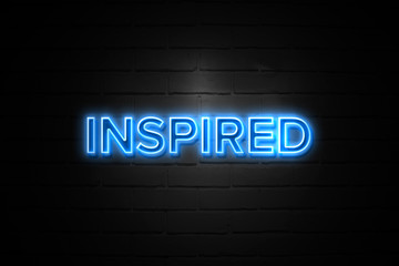 Inspired neon Sign on brickwall