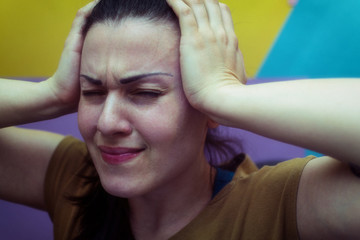 Girl holding her head. Headache. Work. Stress.