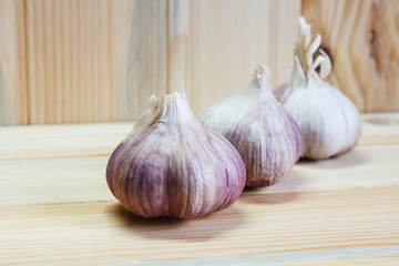 Garlic. Garlic Bulb on a wooden background. Place for text, copy space Concept of healthy food. Selective focus. Close-up.